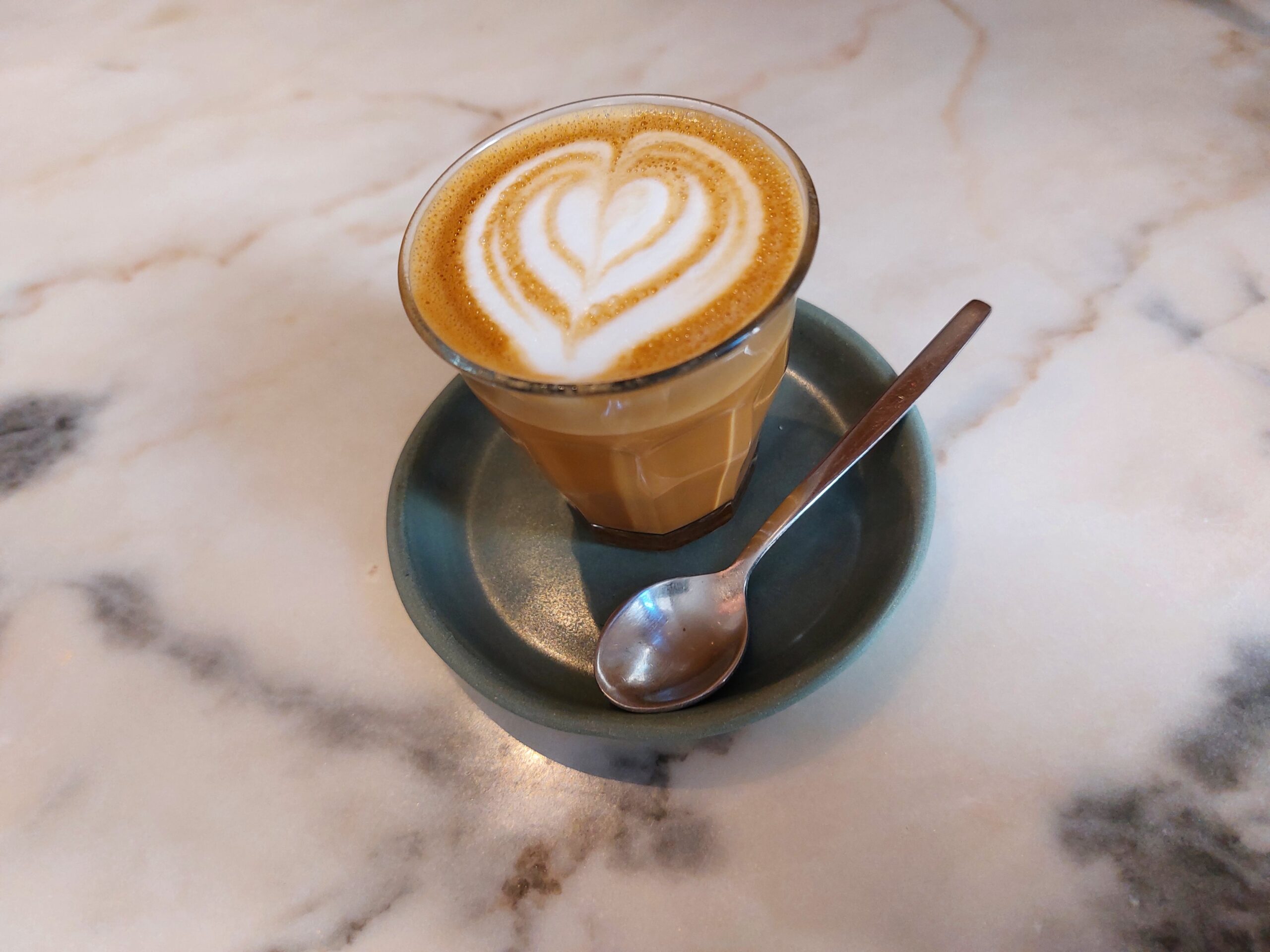 Cortado in a Small Glass With a Latte Art Heart