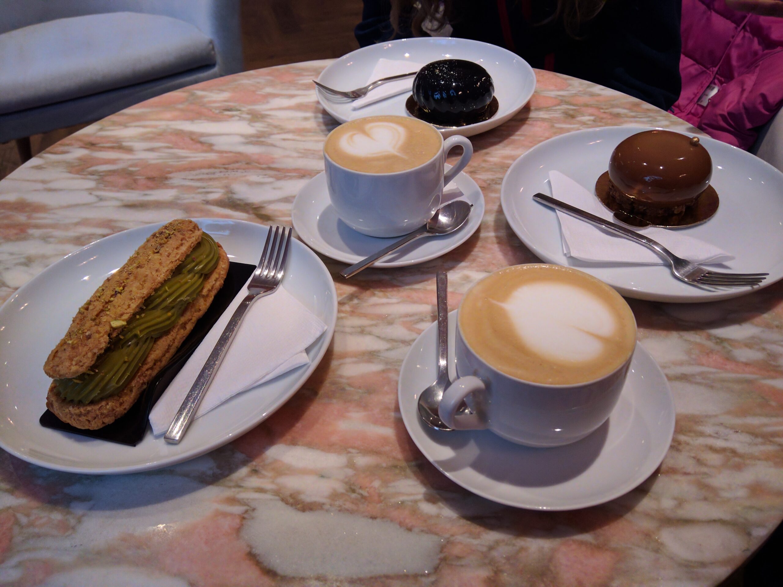 Cappuccinos With Latte Art Hearts and Glazed Pastries