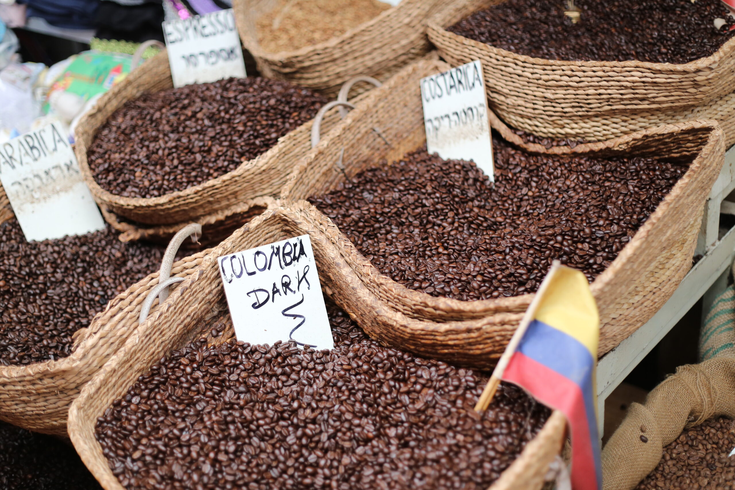 Baskets of Roasted Coffee Beans Labeled by Origin